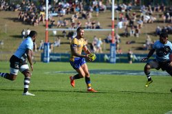 Quade Cooper dabbing a little kick through the line for Brisbane City.