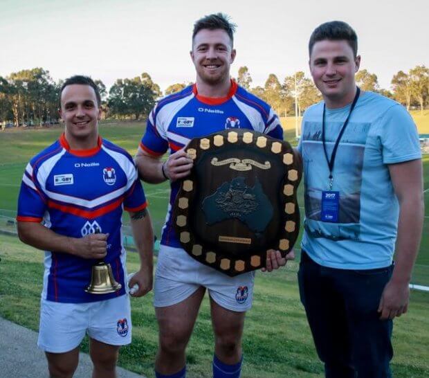 GAGR's Nick Wasiliev and Nick Hartman hand over the Horan-Little Shield and the Benn Robinson Bell over to Rams captain Jed Holloway and Jai Ayoub (Image Credit - Serge Gonzalez) 