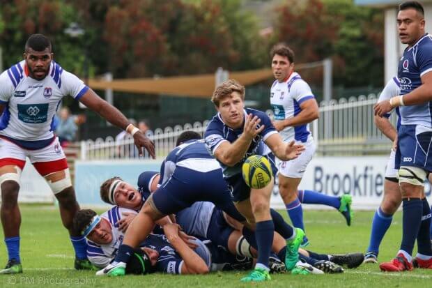 James Tuttle clears the ball.