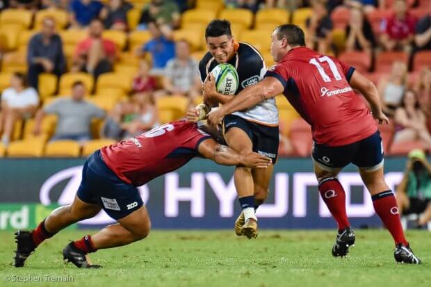 Wharenui Hawera tries to break the tackle of Alex Mafi and JP Smith