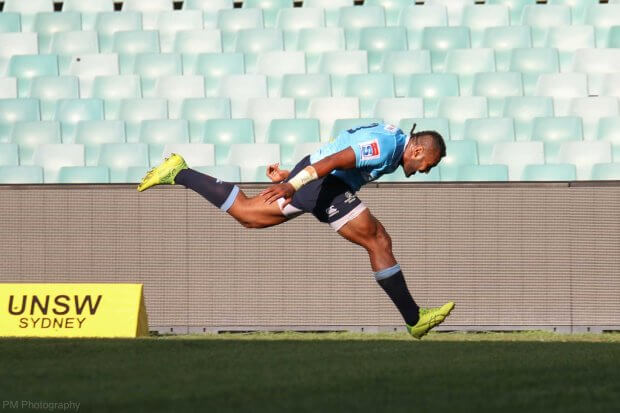 Naiyaravoro can't slow down after scoring in the corner.