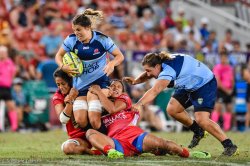 Kirby Sefo and Liz Patu struggle to bring Grace Hamilton down