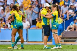 Coach Tim Walsh consoles Dom du Toit after the Gold Medal game loss