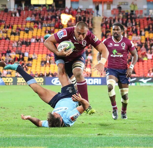 Caleb Timu crunches Nick Phipps to score  