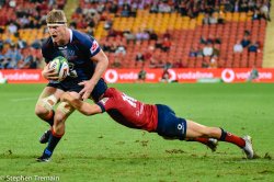 Matt Philip is tackled by Hamish Stewart.