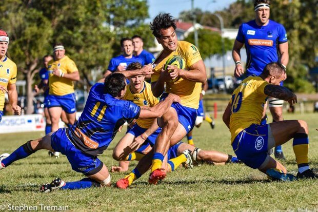 Karmichael Hunt is tackled by Rod Davies