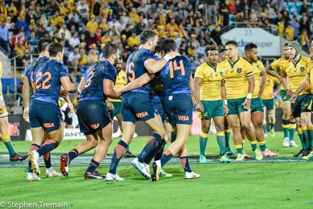 Puma's celebrate a try, watched by the Wallabies