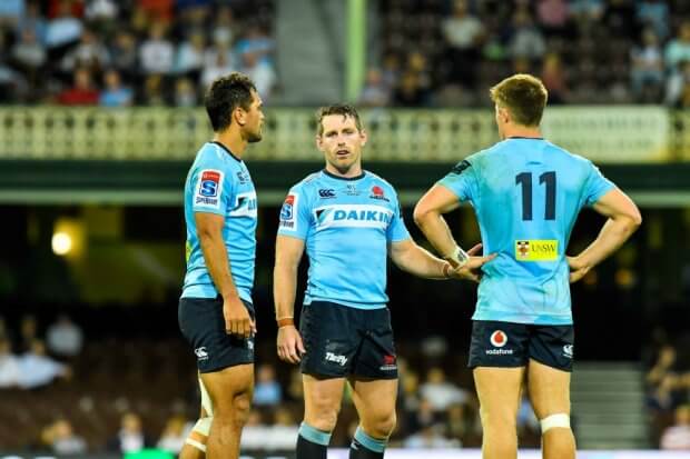 Karmichael Hunt, Bernard Foley Alex Newsome chat Waratahs v Rebels 2019 (Credit Keith McInnes)