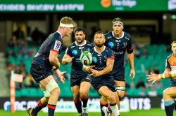 Quade Cooper passes watched by Matt Philip Luke Jones Waratahs v Rebels 2019 (Credit Keith McInnes)